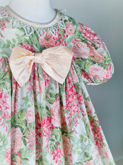 5 years. Vintage floral Bonnie Jean with large pink satin bow, puff sleeves and lace collar