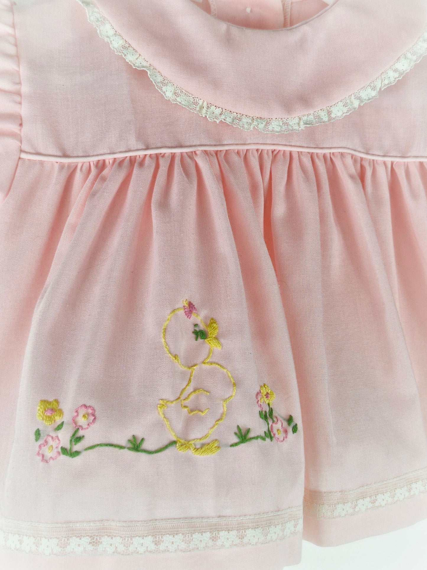 3-6 months. Pink vintage dress with lace hemmed bib and embroidered chick