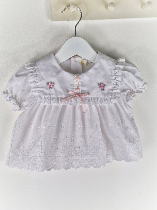 0-6 months. White vintage broderie anglais dress with pink satin ribbon