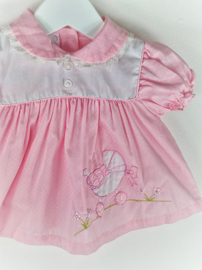 3-6 months. Pink vintage dress with embroidered pram, bow and flowers