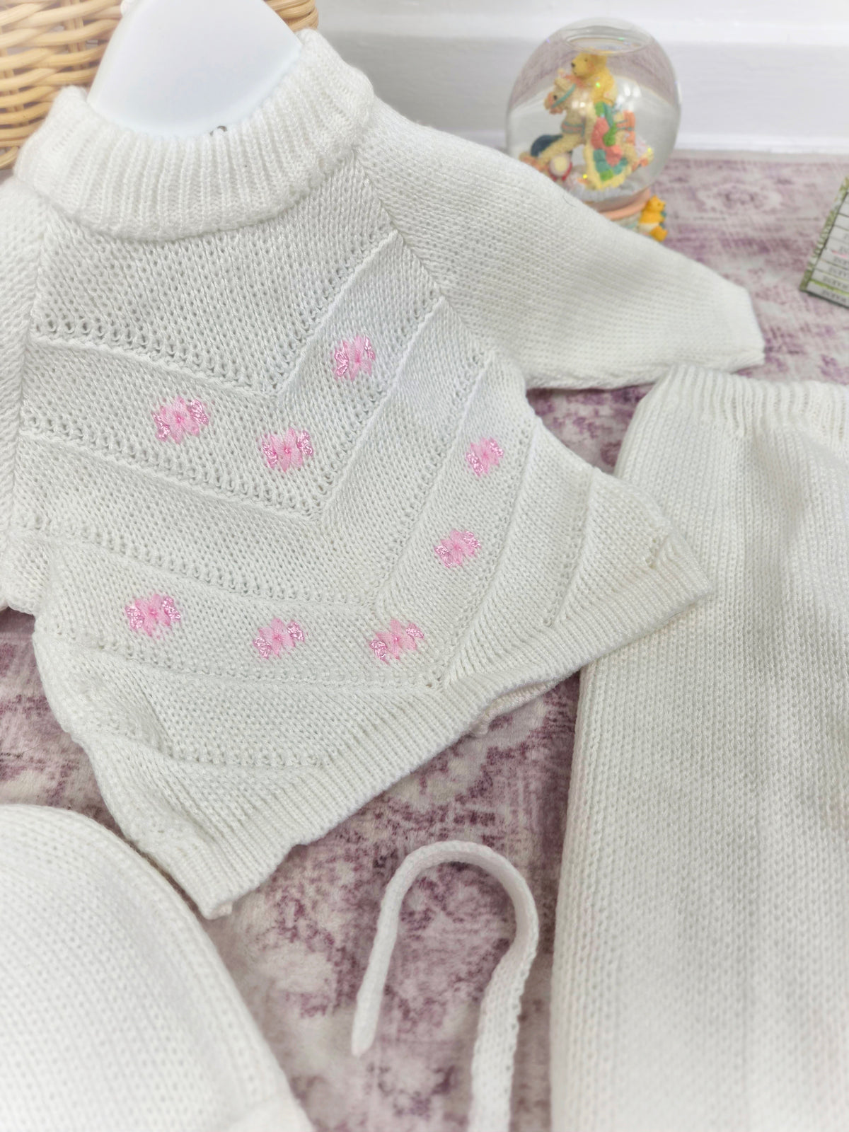 0-6 months. Three-piece knit set. White with pink flowers