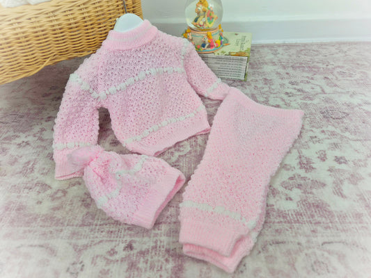 6 months. Three-piece knit set, pink with white pattern