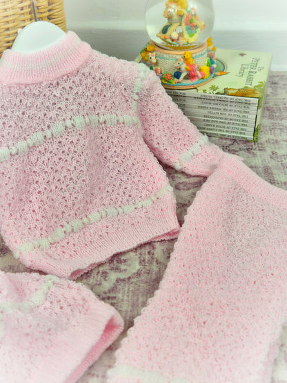 6 months. Three-piece knit set, pink with white pattern