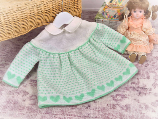Best fit 3-6 months. White jumper dress with mint hearts designs