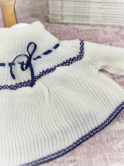 0-6 months. High-neck knit jumper with blue design