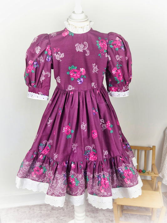 7 years. Handmade Daisy Kingdom dress, burgundy with floral designs