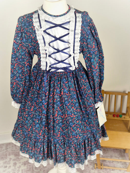 7-8 years. Navy floral vintage dress by Carolyn's Collection with satin ribbon and lace