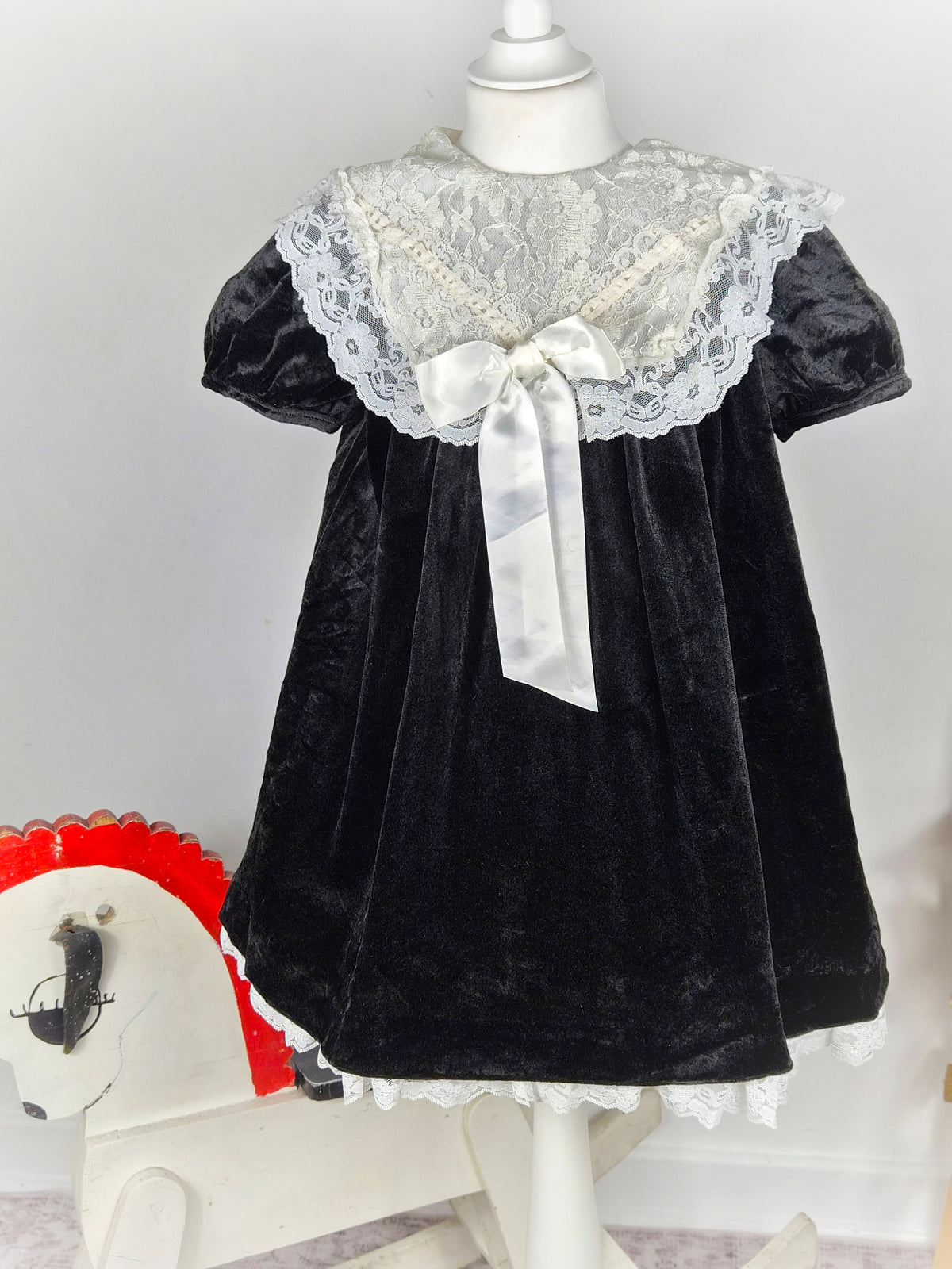 5 years. Black velvet vintage dress from Emily West with cream lace collar & hem and satin bow