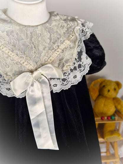5 years. Black velvet vintage dress from Emily West with cream lace collar & hem and satin bow