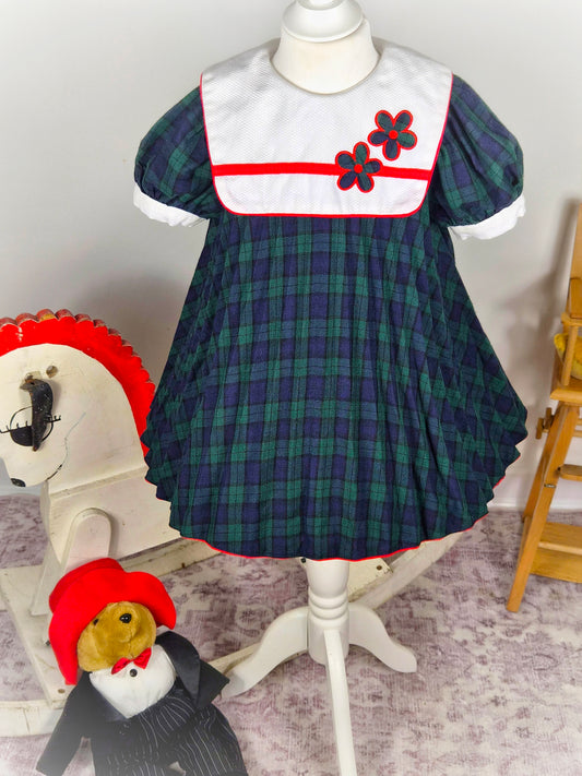 3 years. Navy and green tartan vintage dress from Thomas with mini pleats, white bib and floral designs