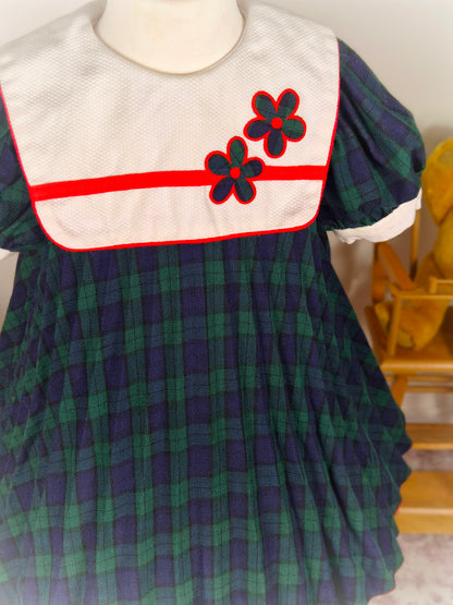 3 years. Navy and green tartan vintage dress from Thomas with mini pleats, white bib and floral designs