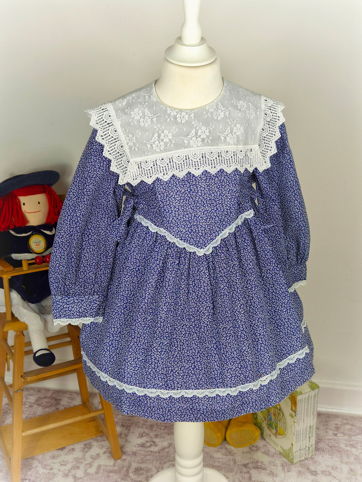 3-4 years. Navy blue vintage dress with white floral patterns from Special Occasions with white lace bib and trim