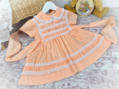18-24 months. Peach vintage smock Michael de Leon dress with white lace and dainty embroidered flowers