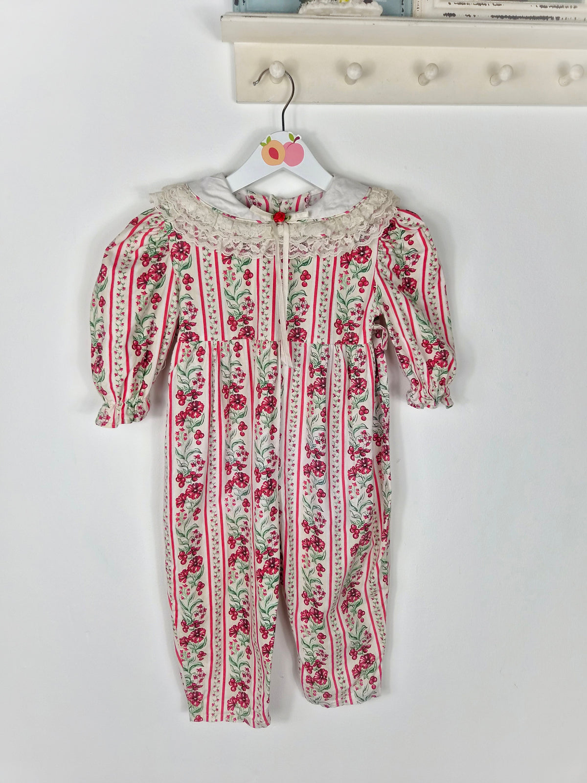 2 years. Cream festive vintage romper with red flowers and berries print and lace trimmed bib