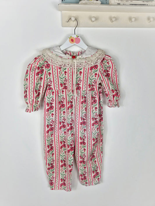 2 years. Cream festive vintage romper with red flowers and berries print and lace trimmed bib