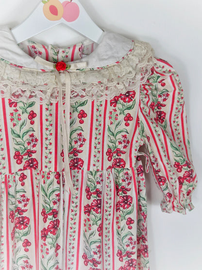 2 years. Cream festive vintage romper with red flowers and berries print and lace trimmed bib