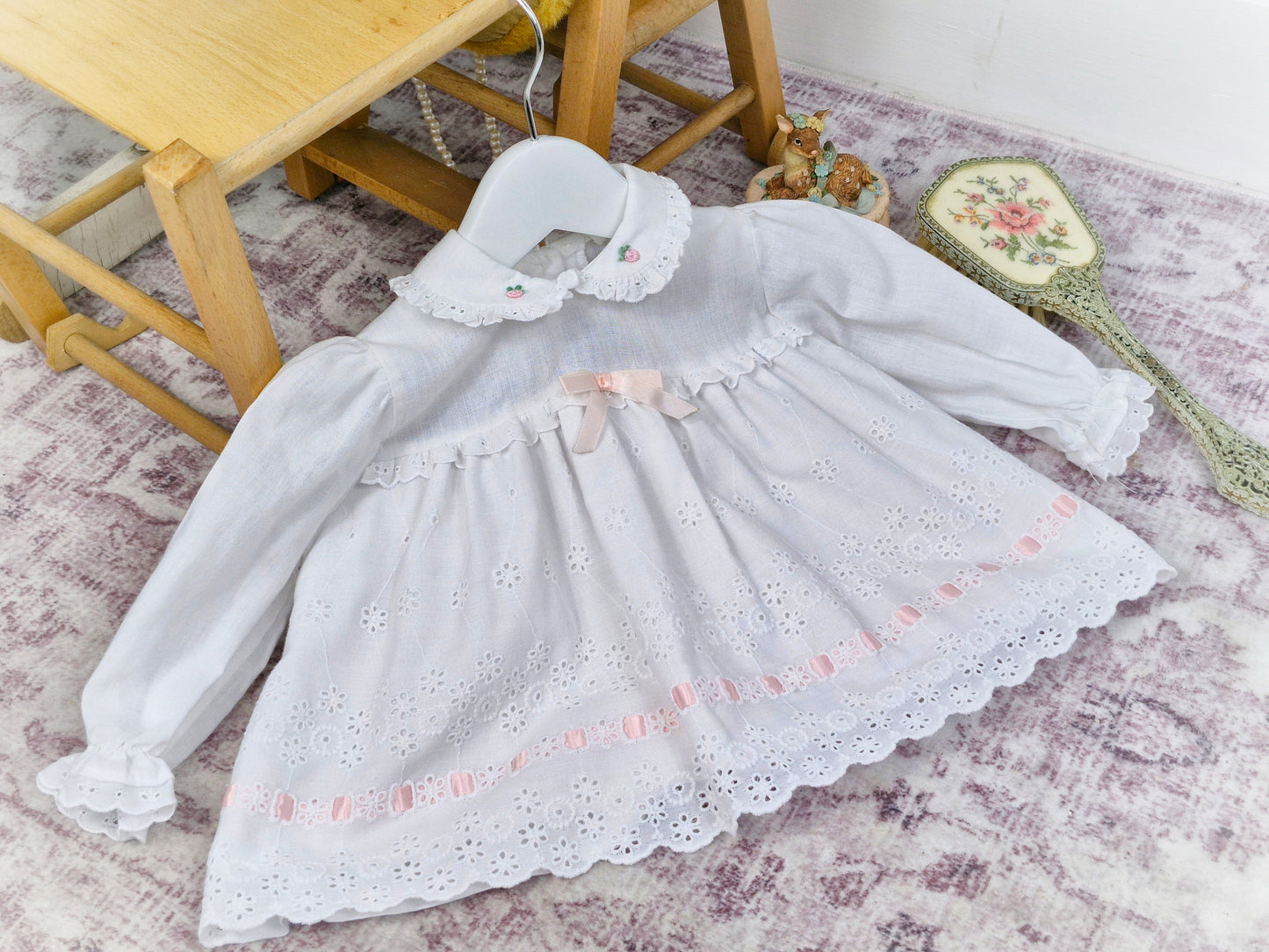 6-9 months. White vintage dress with long sleeves, eyelet details and pink satin ribbon