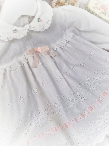 6-9 months. White vintage dress with long sleeves, eyelet details and pink satin ribbon