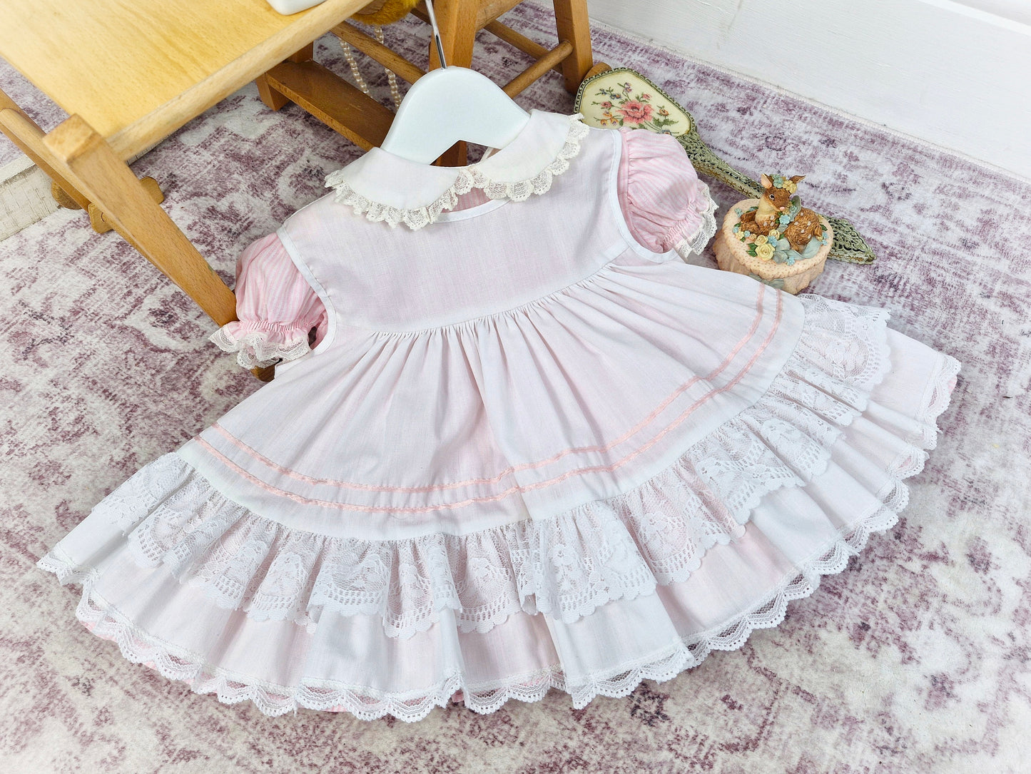 9-12 months. Vintage pink and white candy striped Bryan dress with white apron, pink satin lace, ruffles and lace