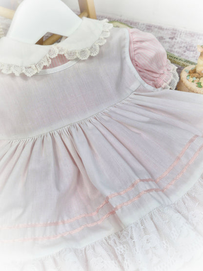 9-12 months. Vintage pink and white candy striped Bryan dress with white apron, pink satin lace, ruffles and lace