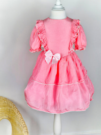 4-5 years. Pink handmade dress with ruffles and a lighter pink satin bow