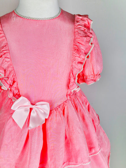 4-5 years. Pink handmade dress with ruffles and a lighter pink satin bow