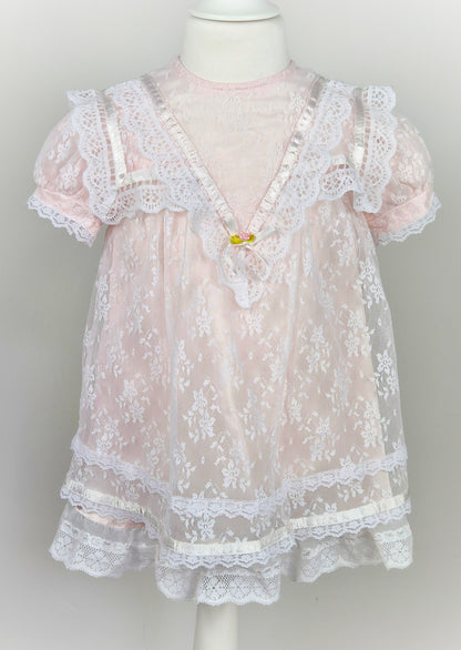 3 years. Pale pink vintage Jessica McClintock dress with white lace overlay, puff sleeves, pink satin ribbon trim and rosette