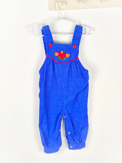 12-18 months. Royal blue corduroy dungarees with red buttons and heart and floral pattern
