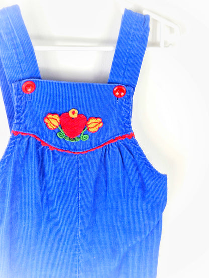 12-18 months. Royal blue corduroy dungarees with red buttons and heart and floral pattern