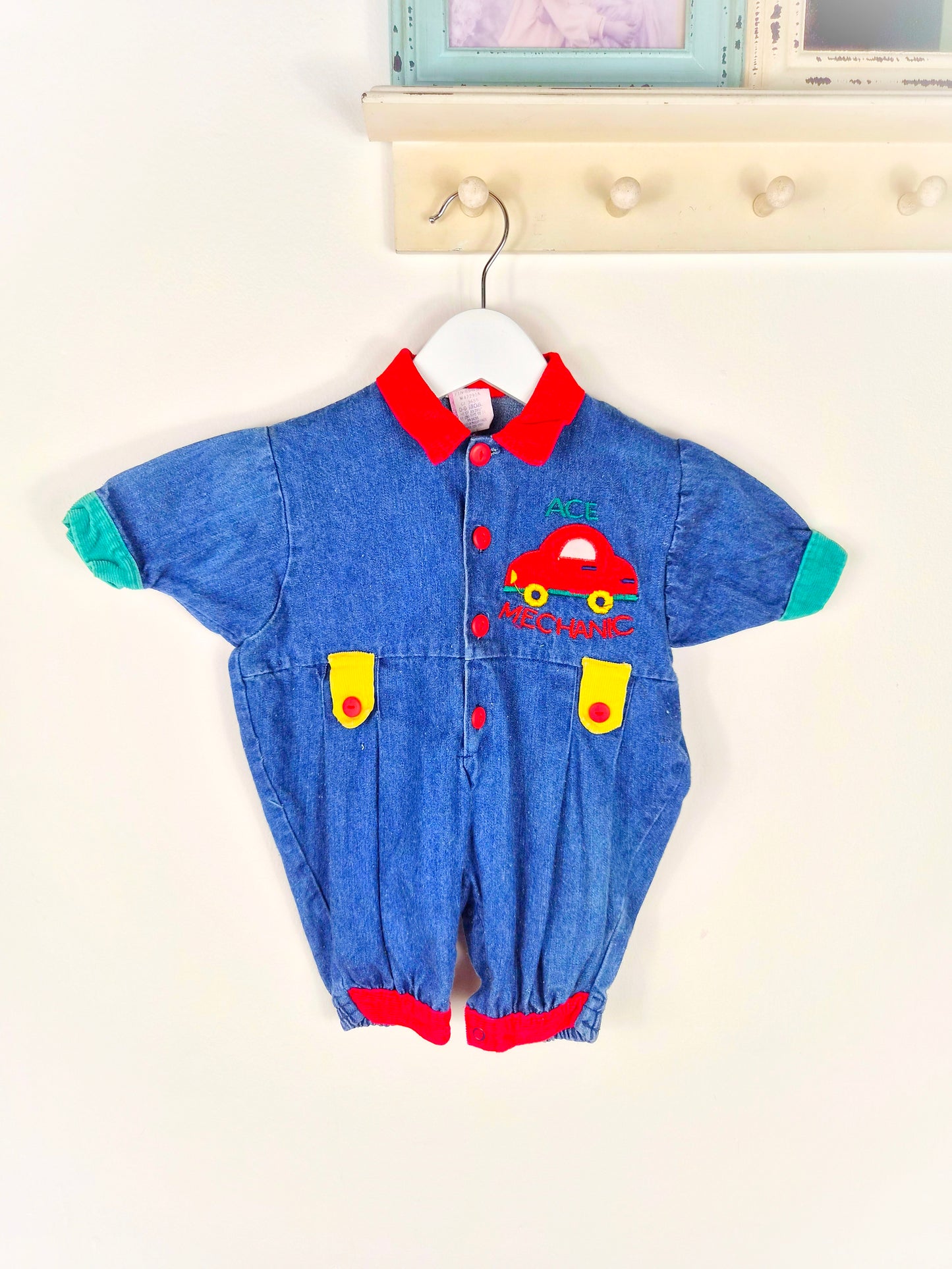 6 months. Denim romper with car applique and primary colour details