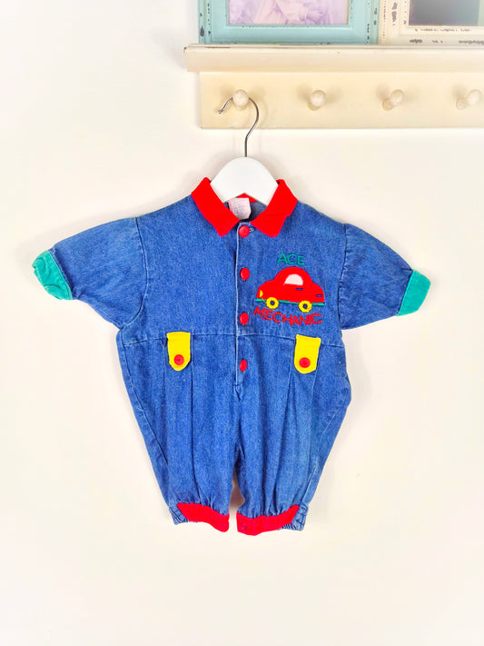 6 months. Denim romper with car applique and primary colour details