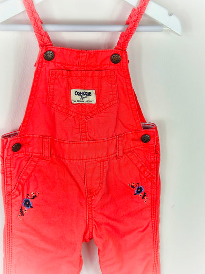 12 months. Coral Oshkosh dungarees with embroidered flowers and braided straps