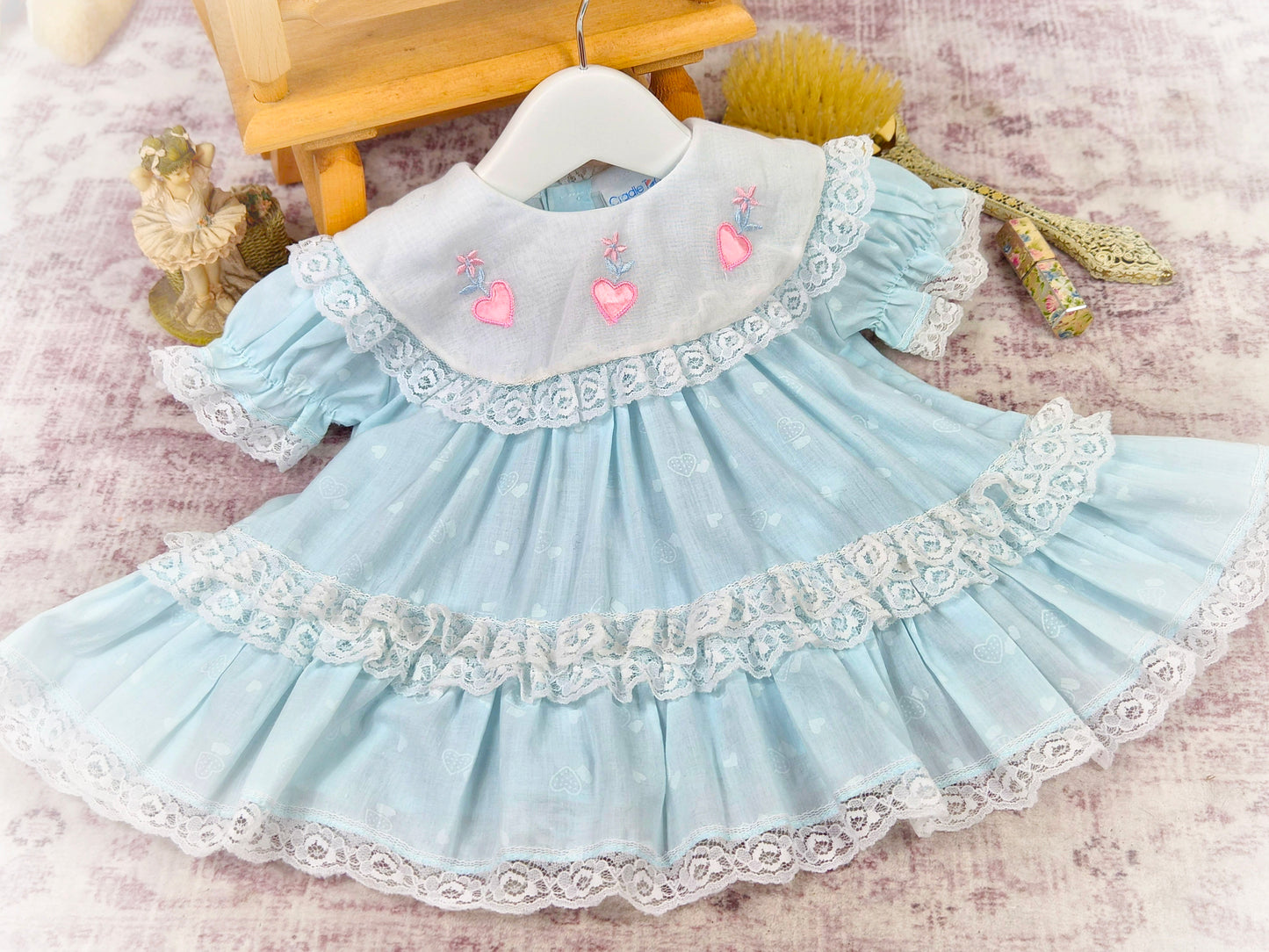 12 months. Mint vintage dress with white bib, pink embroidered hearts and lace trim