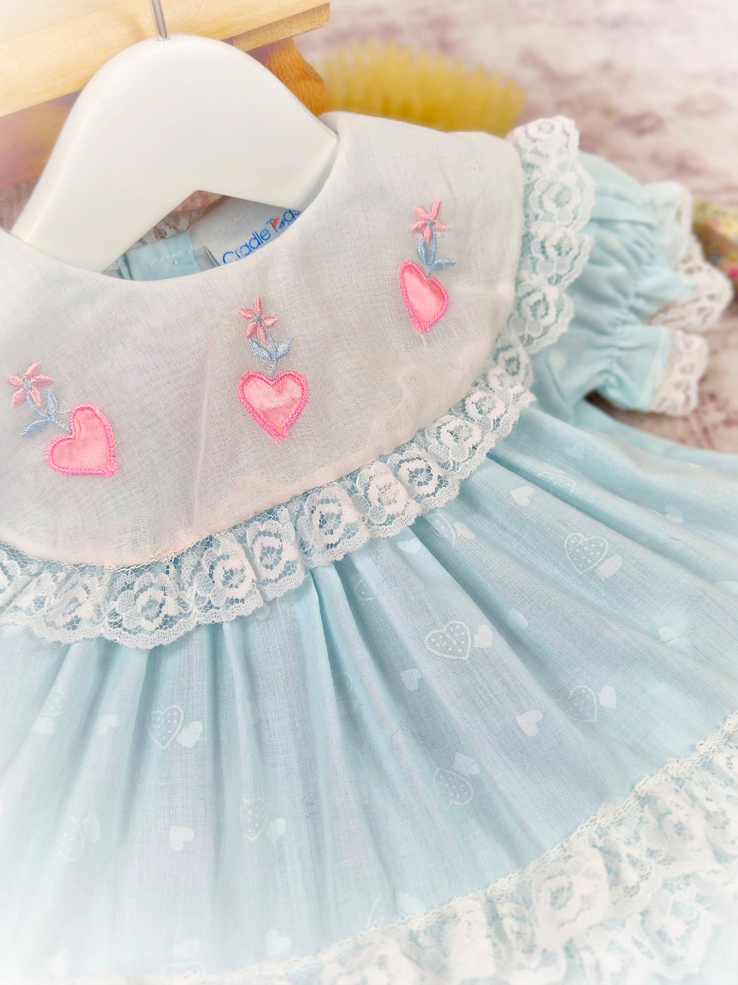 12 months. Mint vintage dress with white bib, pink embroidered hearts and lace trim