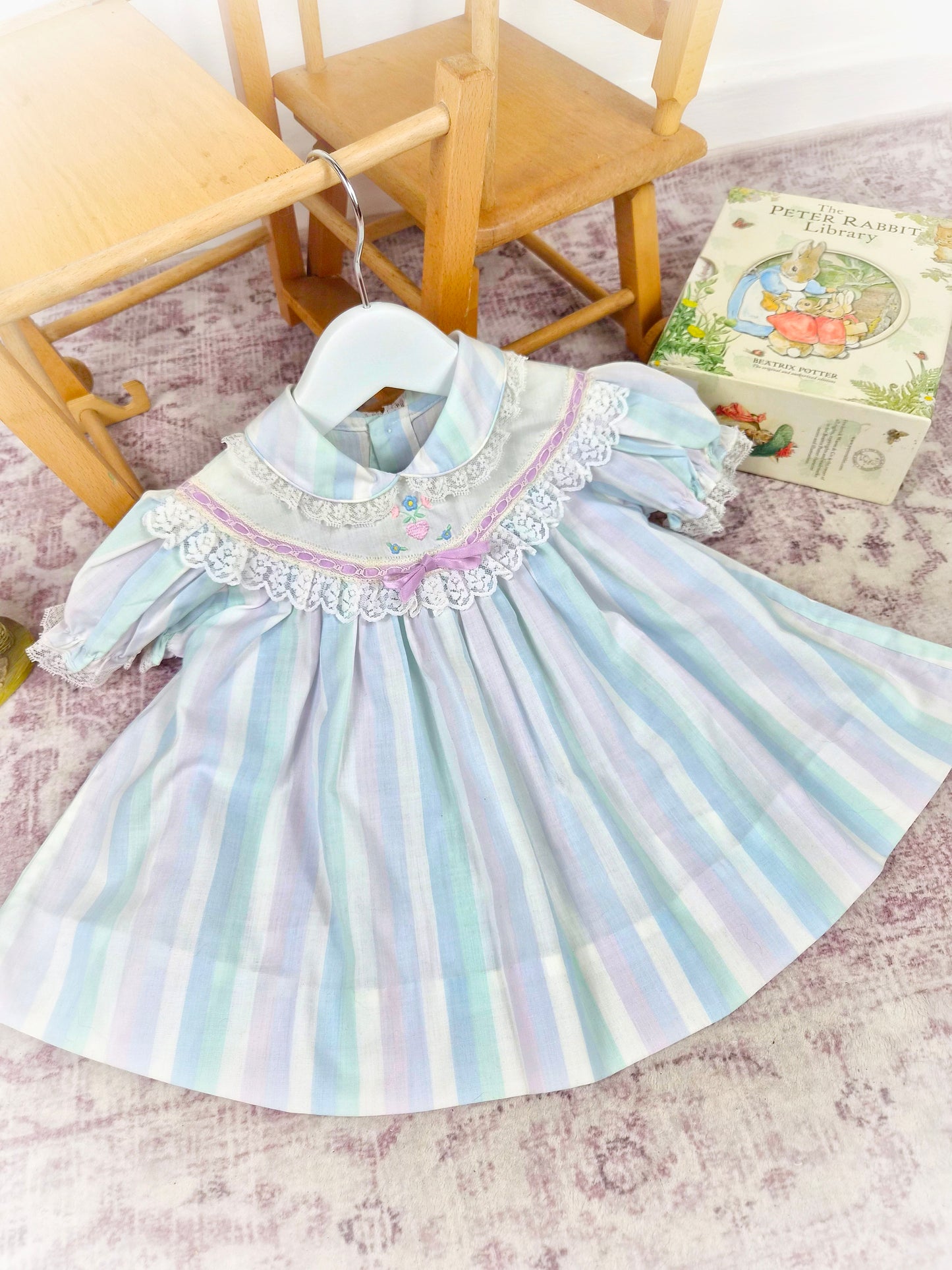 9-12 months. Pastel striped vintage dress with lace details and embroidered design