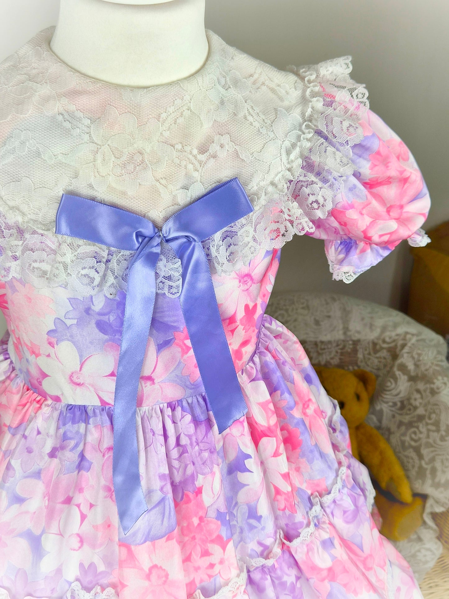 4-5 years. Pink and purple floral vintage dress from Martha's Too with white lace bib and purple satin ribbon bow
