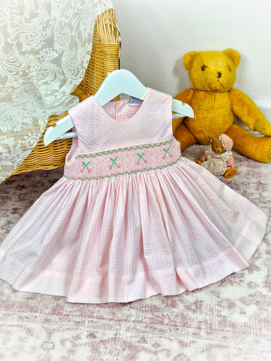 12 months. Pink sleeveless vintage smock dress with embroidered cherries