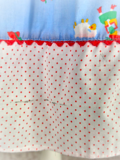 3 years. Blue, white and red "back to school" dress with apple pockets