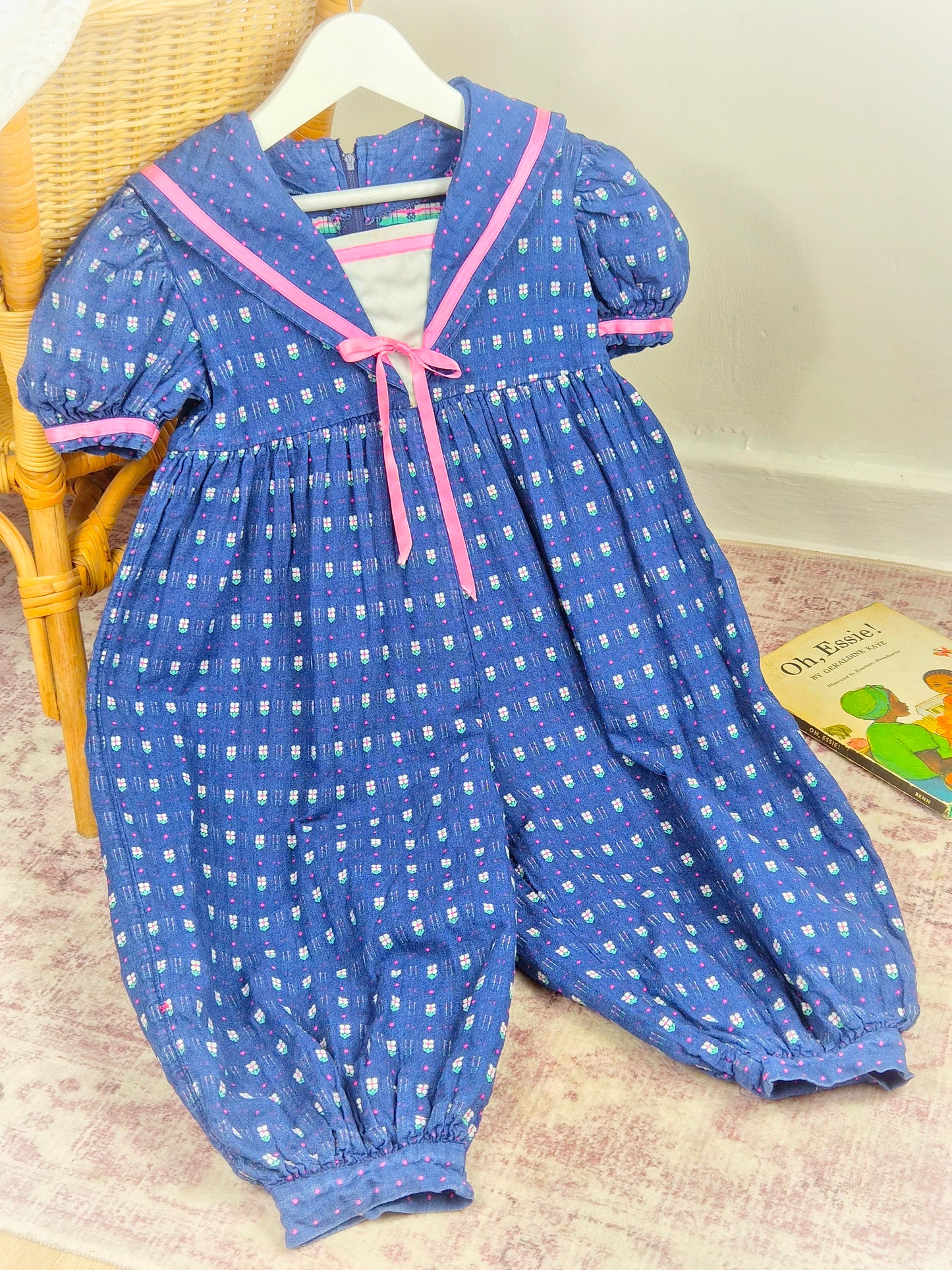 2-3 years. Blue vintage romper with pink satin ribbon and floral details