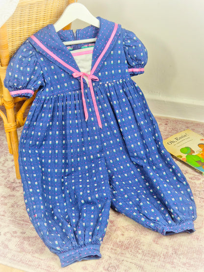 2-3 years. Blue vintage romper with pink satin ribbon and floral details