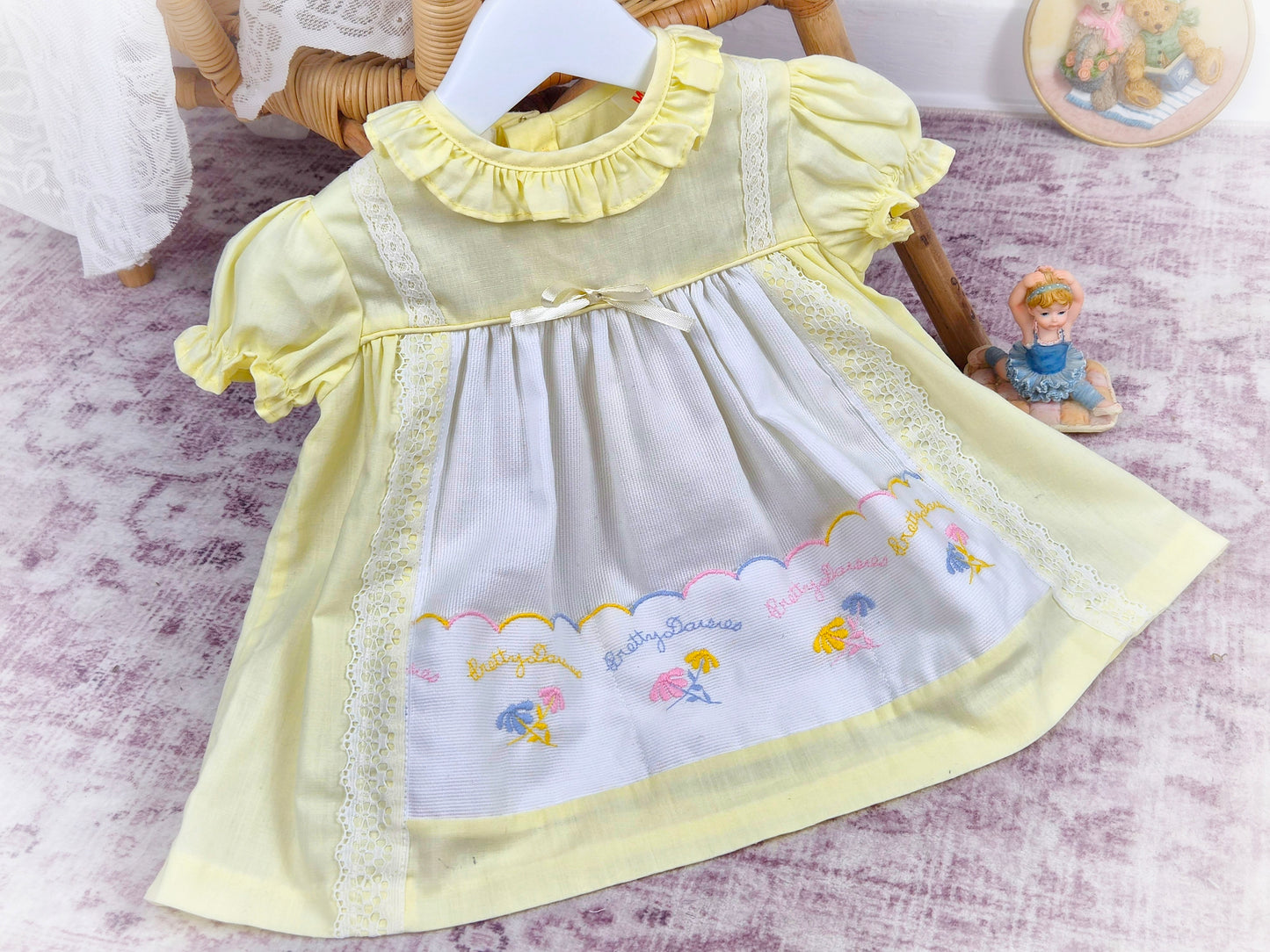 9-12 months. Lemon and white vintage dress with embroidered "pretty daisies" by Winnie the Pooh