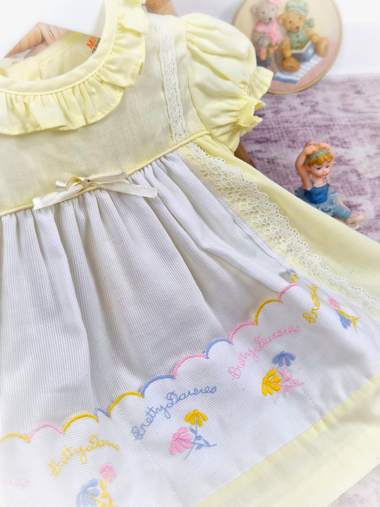 9-12 months. Lemon and white vintage dress with embroidered "pretty daisies" by Winnie the Pooh