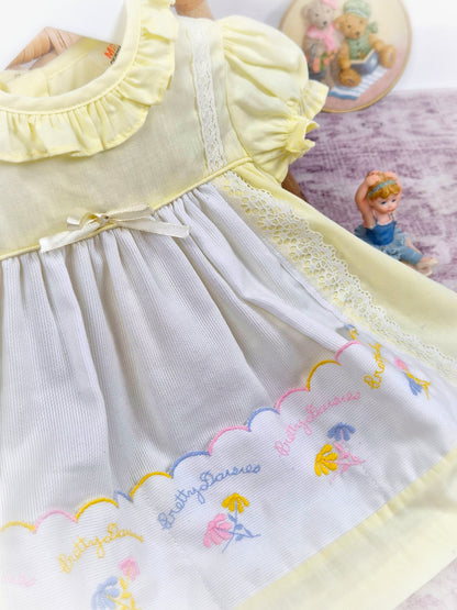 9-12 months. Lemon and white vintage dress with embroidered "pretty daisies" by Winnie the Pooh