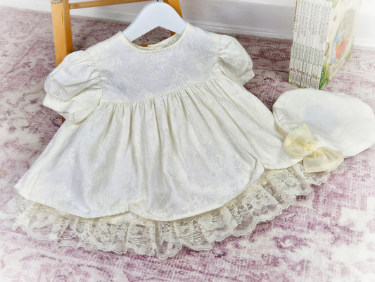 12-18 months. Cream vintage dress with puff sleeves, lace hem and matching hat