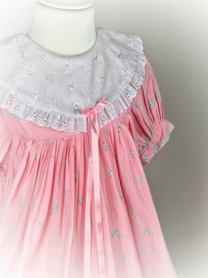 9-10 years. Pink floral vintage dress with multicultural girls, white eyelet bib and pink ribbon. See description*