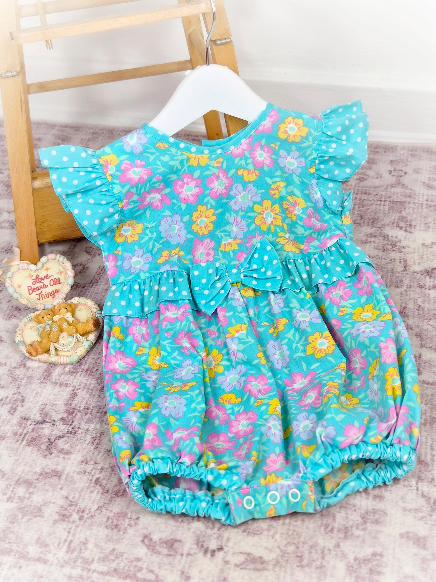 12-18 months. Floral short romper with polka dot frills by Cuties by Judy