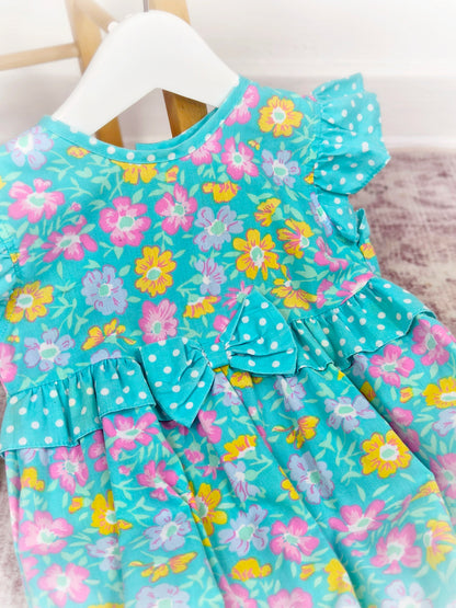 12-18 months. Floral short romper with polka dot frills by Cuties by Judy