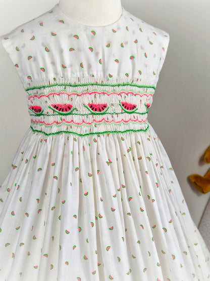 4-5 years. White sleeveless smock dress with embroidered watermelon and print