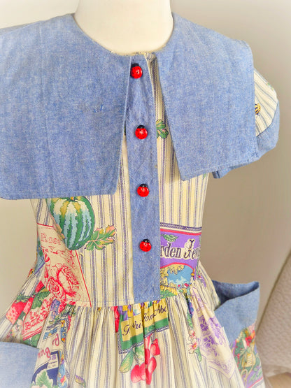6 years. Vintage dress with fruit and floral print, denim collar and pockets and cute ladybug buttons