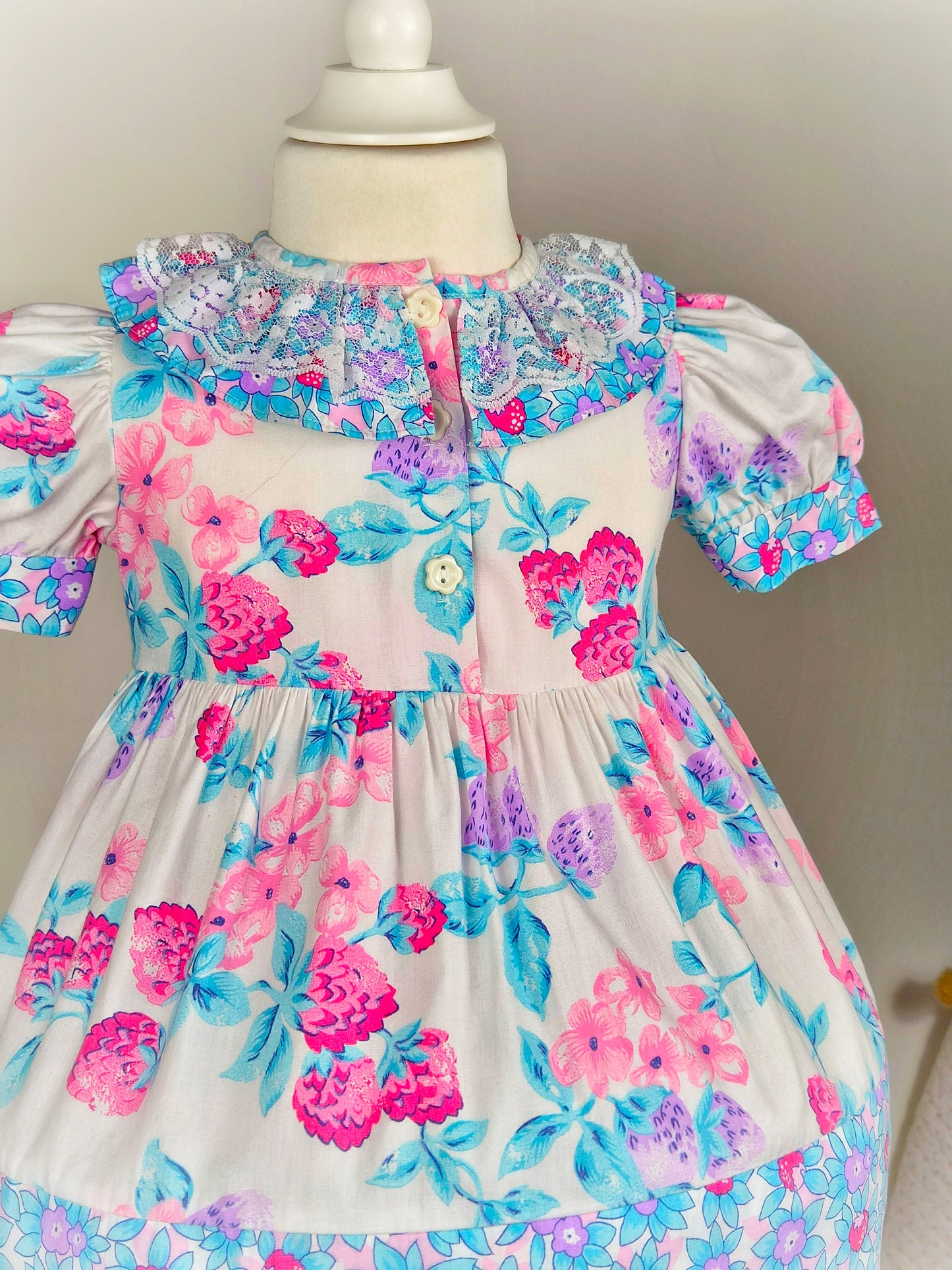 2 years. Vintage dress from Picture Perfect with fruit print, puff sleeves and lace collar
